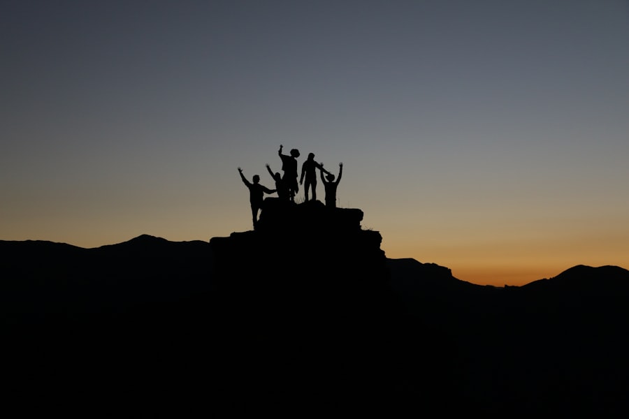 Team on a hilltop at golden hour