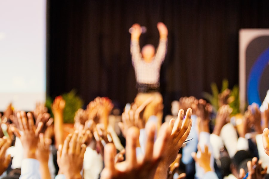 Crowd celebrating with raised hands